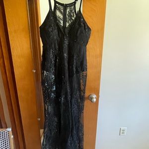 Size 12 black lace gown. Bra cups already sown in.  Worn once for a photoshoot